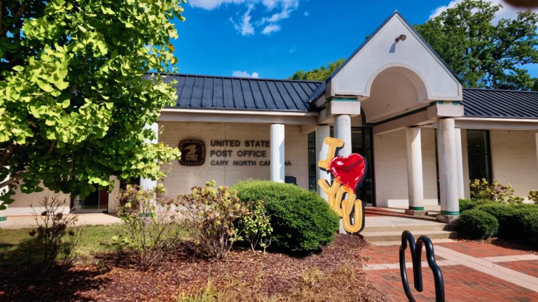 Downtown Cary post office entrance with white columns, and a LOVE sign with a red heart out front