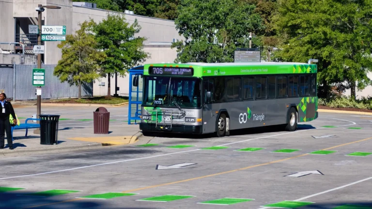 GoTriangle route 705 bus signed Downtown Durham and Hub RTP, stopped at a covered bus bay